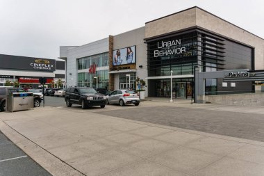 ABBOTSFORD, CANADA - JUNE 9, 2019: Shopping mall in city center with shops banks and parking lots.