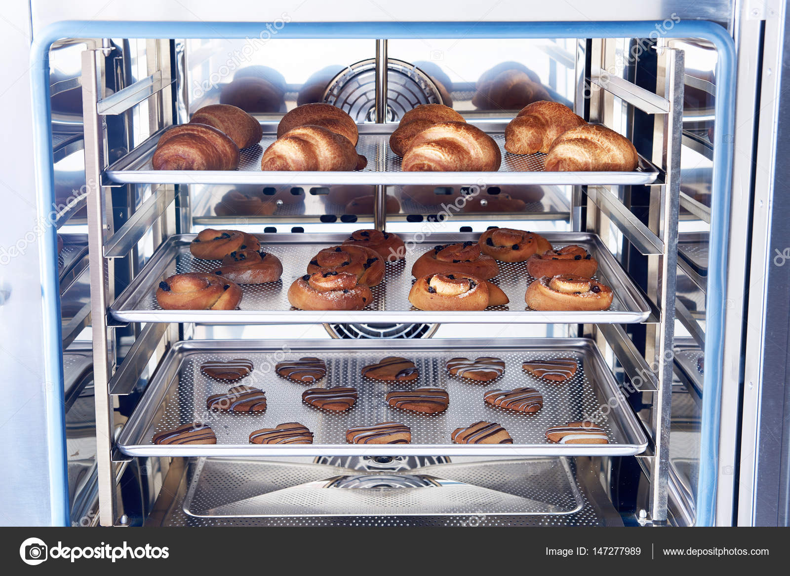 Dessert bread baking in Combi steamer. Production oven at the bakery