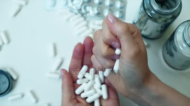 Woman fingering pills in her hand, Tablet in hand, — Stock Video
