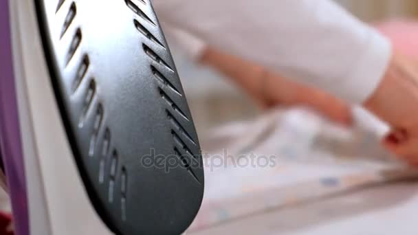 Attractive and beautiful woman ironing clothes at home. Close-up — Stock Video