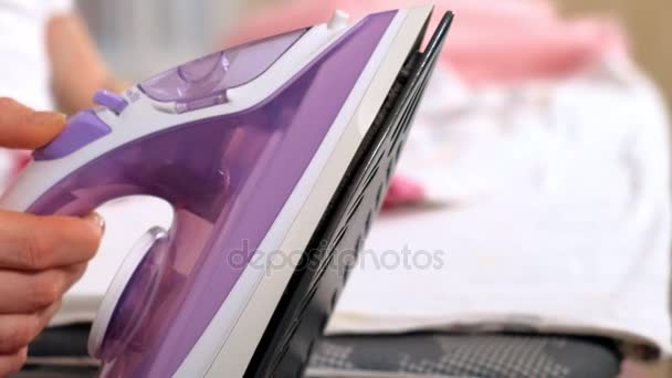 Attractive and beautiful woman ironing clothes at home. Close-up — Stock Footage Attractive and beautiful woman ironing clothes at home. Close-up Video Clip