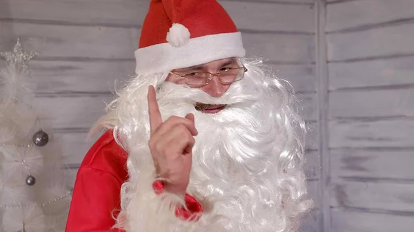 Santa signs to the camera — Stock Photo, Image