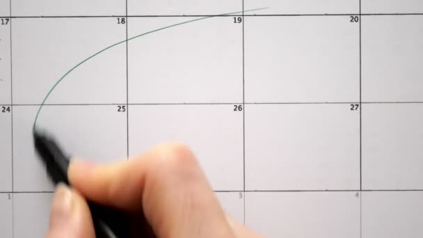 Assine o dia no calendário com uma caneta, desenhe um feriado — Vídeo de Stock