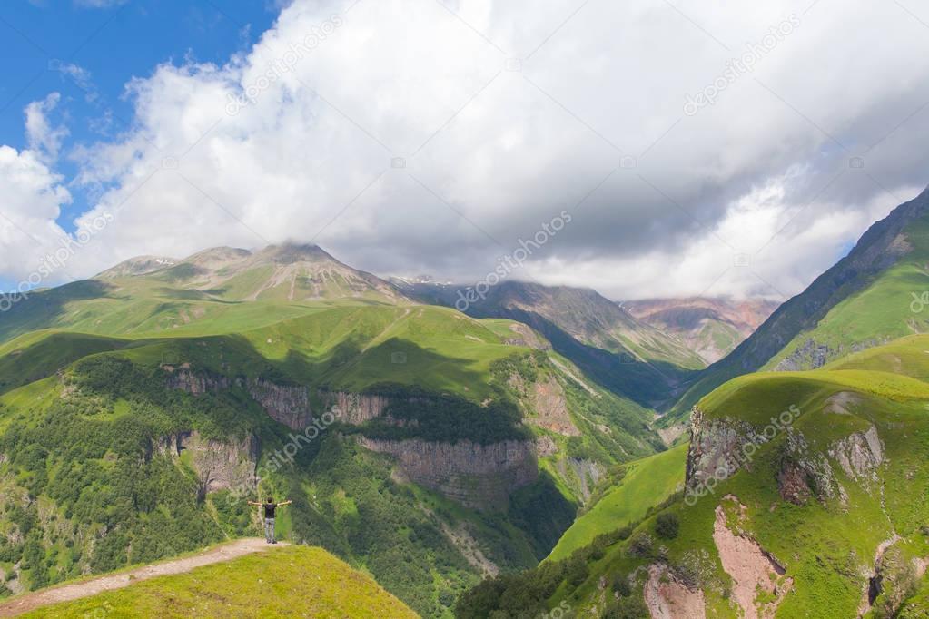 Man standing  on the top of mountain