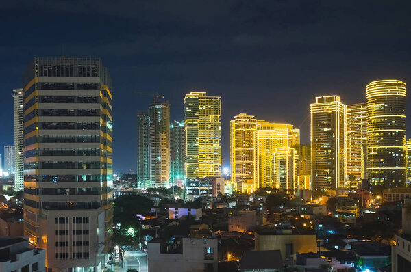 Manila at night. Skyscrapers in Makati