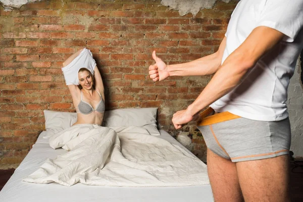 Man Showing Big Thumb Happy Young Woman Undressing Background Focus — Stock Photo, Image