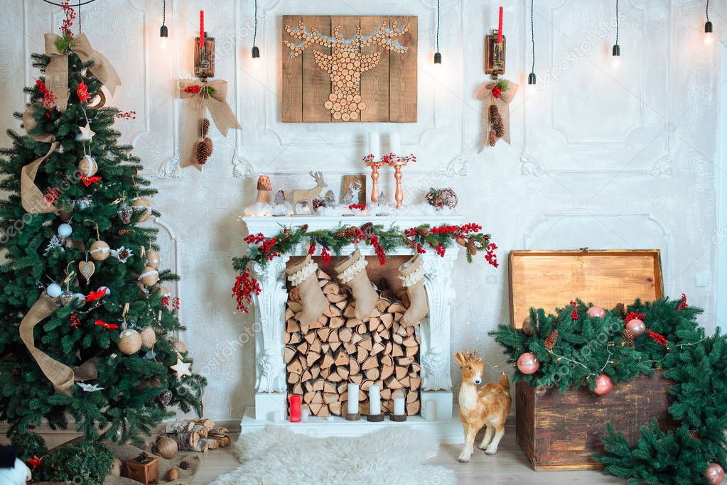 Beautiful holiday decorated room with Christmas tree, fireplace 