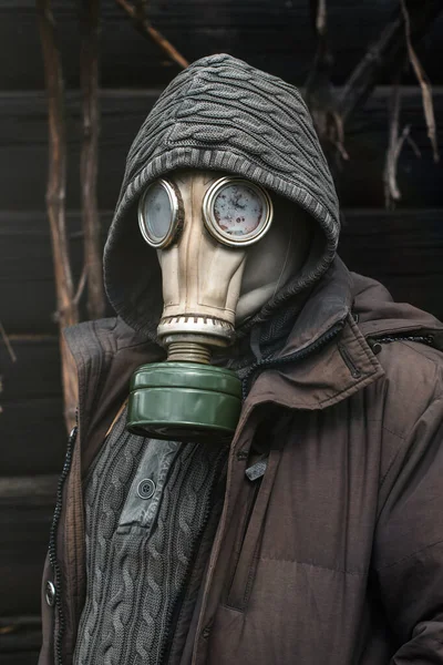 Portrait of a man in a gas mask. Panic during quarantine. Coronavirus pandemia concept. Stalker in a gas mask, Chernobyl Exclusion Zone