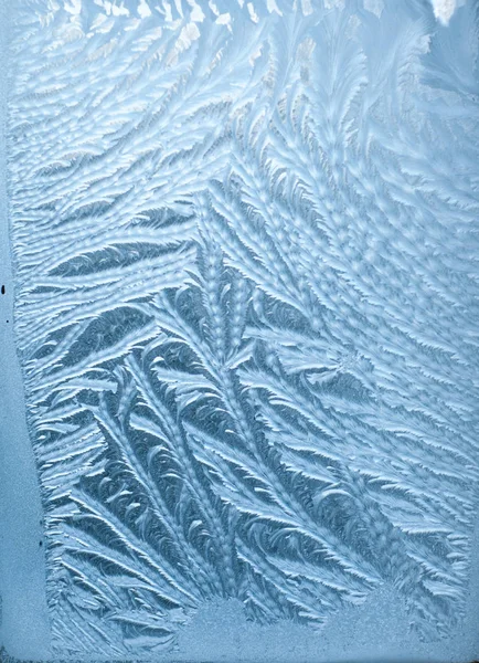 Padrões gelados em vidro no inverno — Fotografia de Stock
