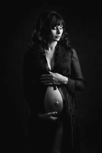 Pregnant girl in black dress — Stock Photo, Image