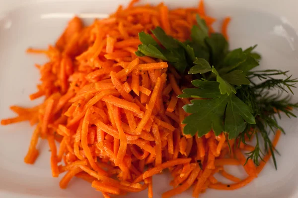 Korean carrot salad. Close-up. Carrots and parsley