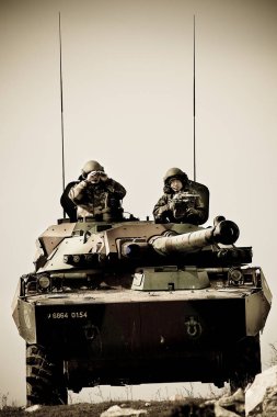 France, the training center of the foreign legion - circa, 2011.Legionnaires on AMX-10 tank during exercises. clipart