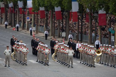 Paris, France - July 14, 2012. Soldiers-musicians march during the annual military parade. clipart