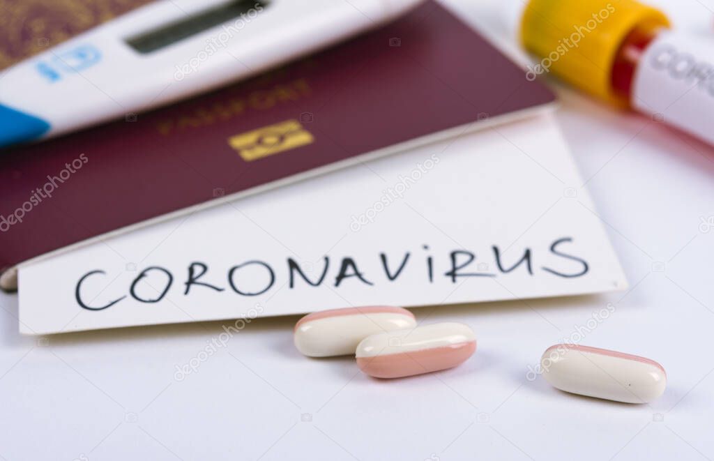 Coronavirus and travel concept. Note COVID-19 coronavirus and passport. Novel corona virus outbreak. Spread of epidemic from China. Border control and quarantine of tourists infected with coronavirus.