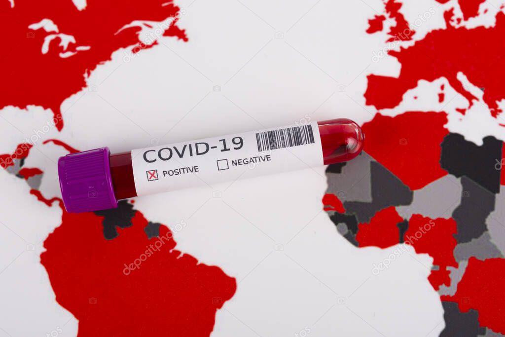 Coronavirus and travel concept. Coronavirus outbreak, epidemic in Wuhan, China. Travel restrictions and quarantine. Blood sample in a tube on a world map showing countries with COVID-19 cases