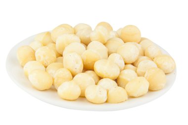 Ahşap zemin üzerinde lezzetli Macadamia fındıkları.