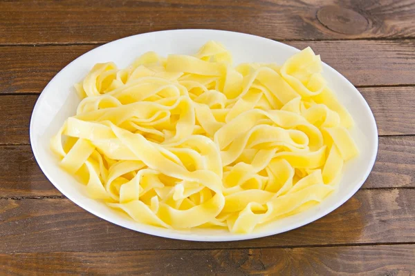 Delicious fettuccine pasta  on  white plate — Stock Photo, Image