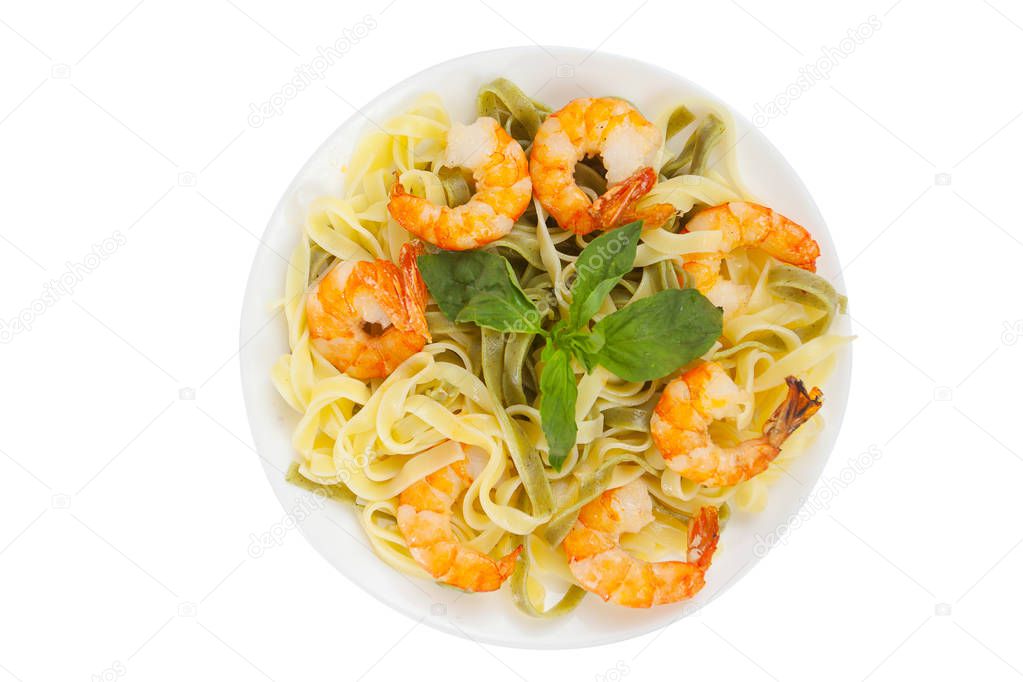 delicious fettuccine pasta with prawns on white plate