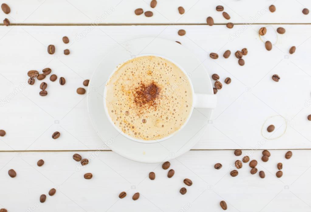 coffee in coffee cup with natural grains