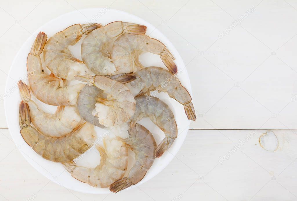 delicious appetizing prawns on white plate on white 
