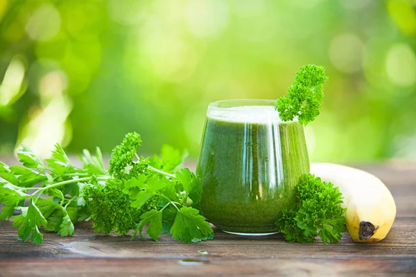 Parsley and celery juice in glass on  table — Stock Photo, Image