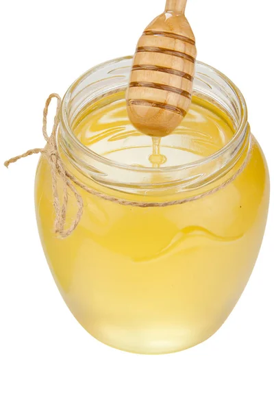 Вкусный вкусный мед в банке на столе — стоковое фото