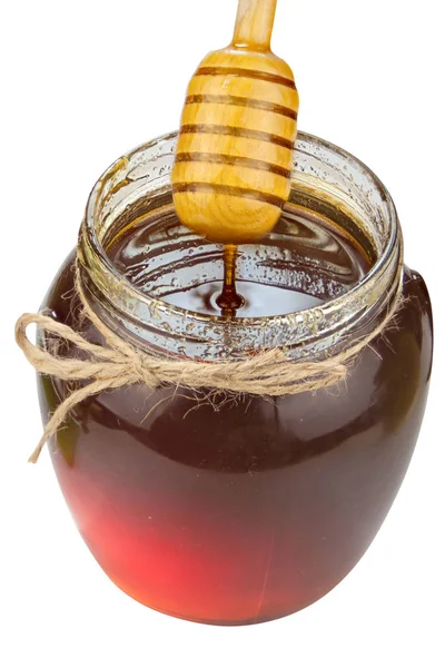 Delicioso delicioso mel em frasco na mesa — Fotografia de Stock