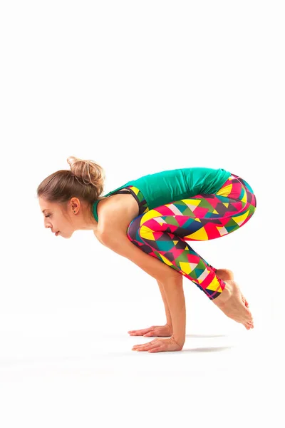 Hermosa mujer flexible haciendo yoga poses en blanco —  Fotos de Stock