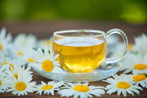Crystal cup with green tea on table — Stock Photo, Image