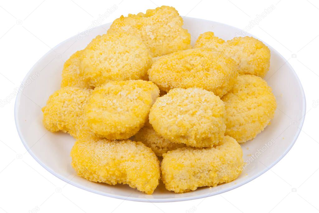 golden chicken nuggets on a white plate on a white background