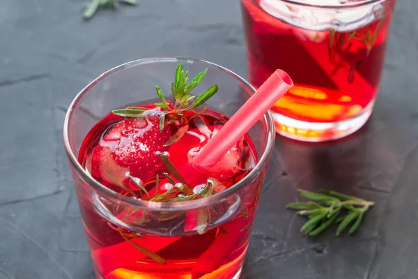 Closeup of Summer refreshing cocktails with strawberry and thyme on a concrete background — Stock Photo, Image