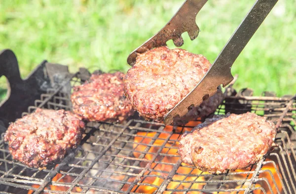 Top view of burger chops preparing on grill — Stock Photo, Image