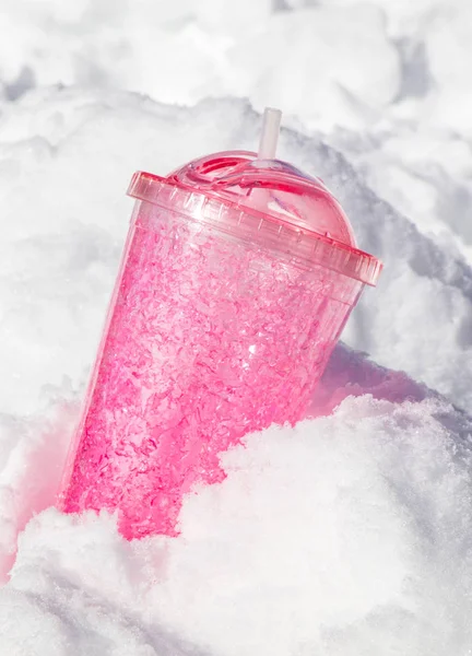 pink travel mug in snow. ice tumbler