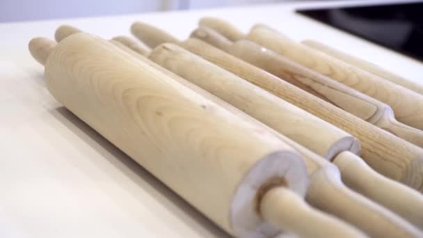 Background, wooden rolling-pin on white surface — Stock Video