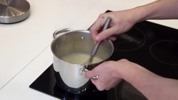 Mixing in a saucepan with a whisk slow mo — Stock Video