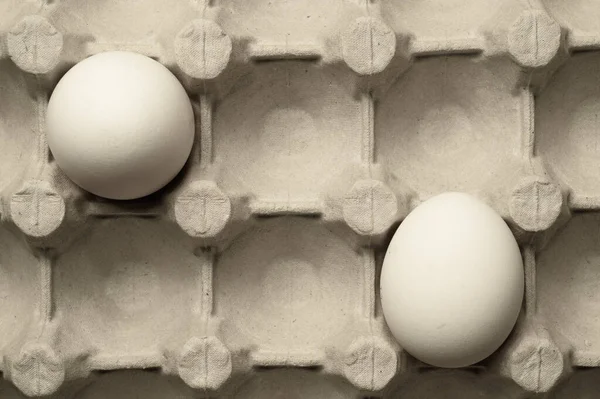 White eggs in carton box background. food ingredient. protein nutrition. healthy breakfast. poultry egg