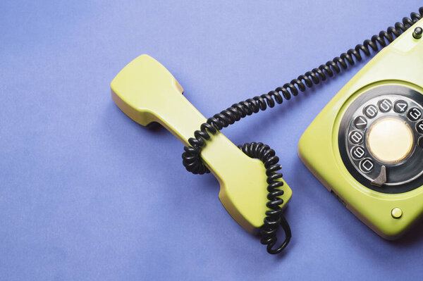 Phone with handset. vintage green telephone with phone receiver. office background. old communication technology. copy space