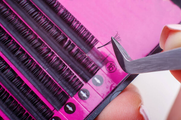 Eyelash Extension tools on white background. Accessories for eyelash extensions. Artificial lashes.