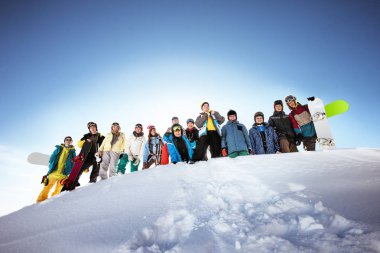 Group of skiers and snowboarders clipart