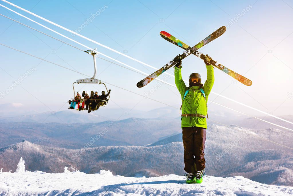 Skies stands ski lift snowboarders backdrop