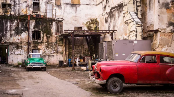 Classical Vintage Cars Parked in an Old Cuban Building Stock Picture