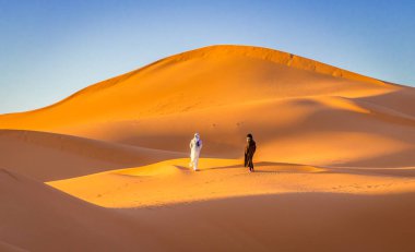Two Berbers in Sahara desert, Merzouga, Morocco