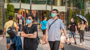 Wearing face masks to protect from Corona virus and smog, Bangkok, Thailand