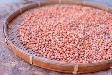 Shelled peanuts in a threshing basket, local market