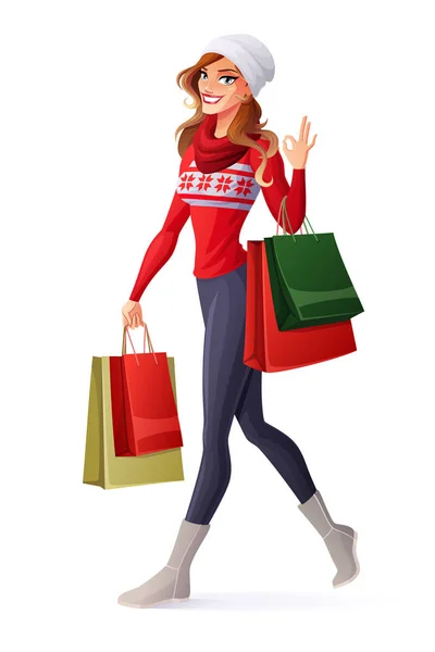 Vector mulher em roupa de Natal com sacos de compras mostrando OK . — Vetor de Stock