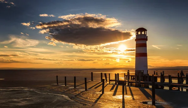 Lighthouse view during winter and dramatic sunset. — Stock Photo, Image