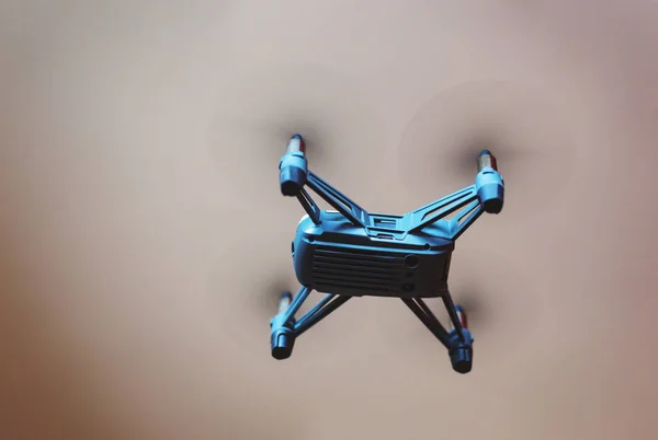 Close-up view under a flying mini drone