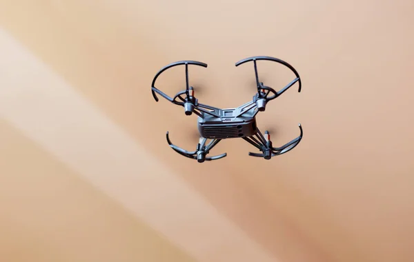Close-up view under a flying mini drone