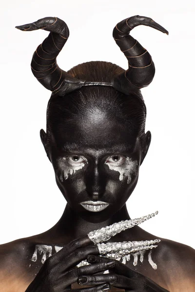 Girl with horns on his head — Stock Photo, Image