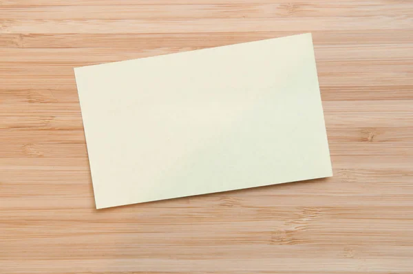 Blank paper note on a table with copy space to add your own text Rechtenvrije Stockafbeeldingen